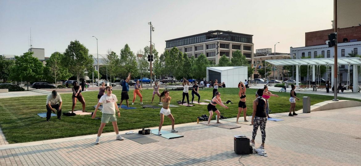 People doing Pilates on the Plaza on the Indianapolis Culture Trail