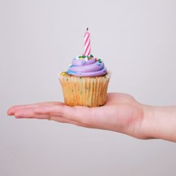 Birthday cupcake in a hand