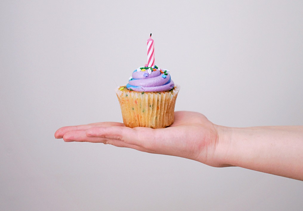 Birthday cupcake in a hand
