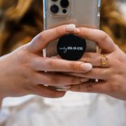 woman using phone with Indy Maven pop socket