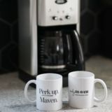 coffee mugs in front of coffee maker