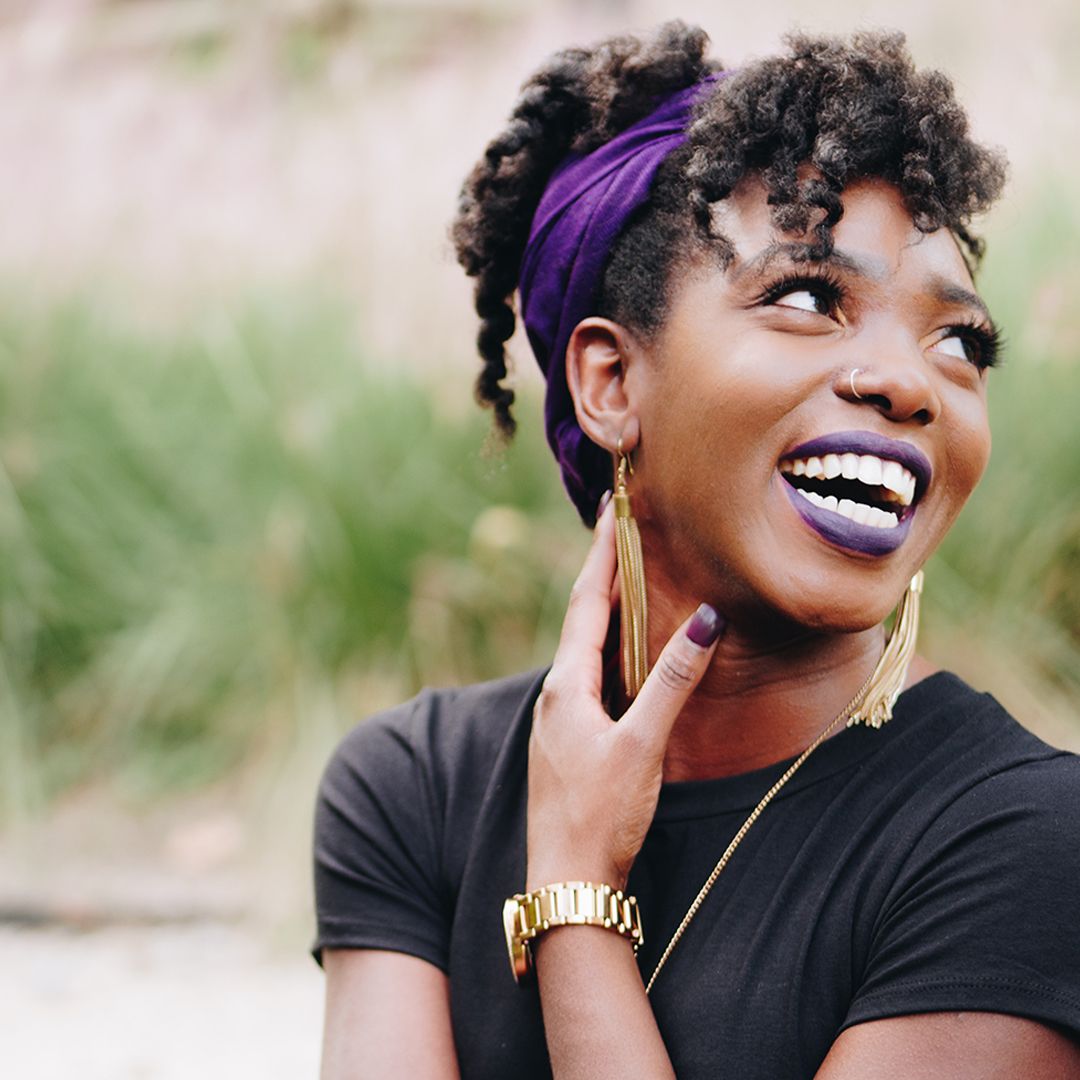 smile black woman with purple scarf