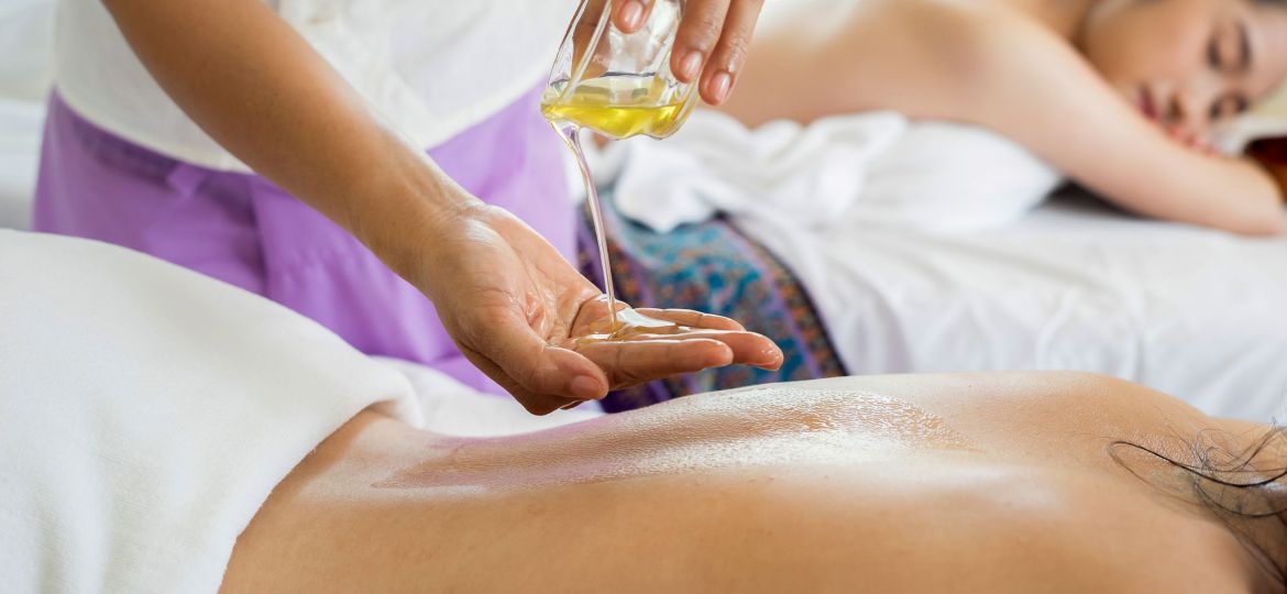 Indy Massage Co._woman using oil for body massage_Indy Maven