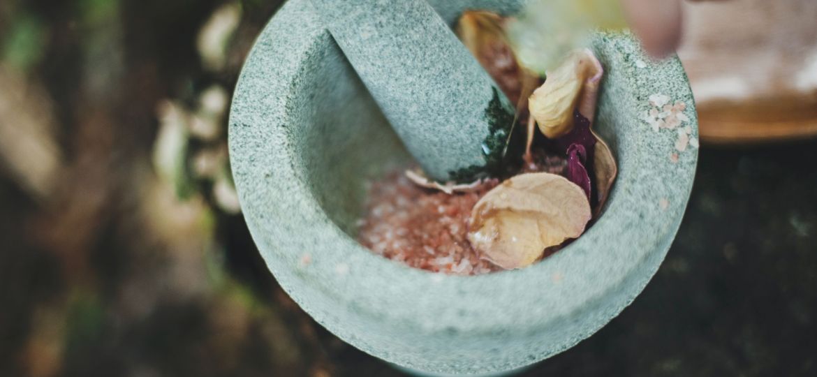 Herbs with mortar and pestle_Materia Medica Herbal Blending Bar & Spa