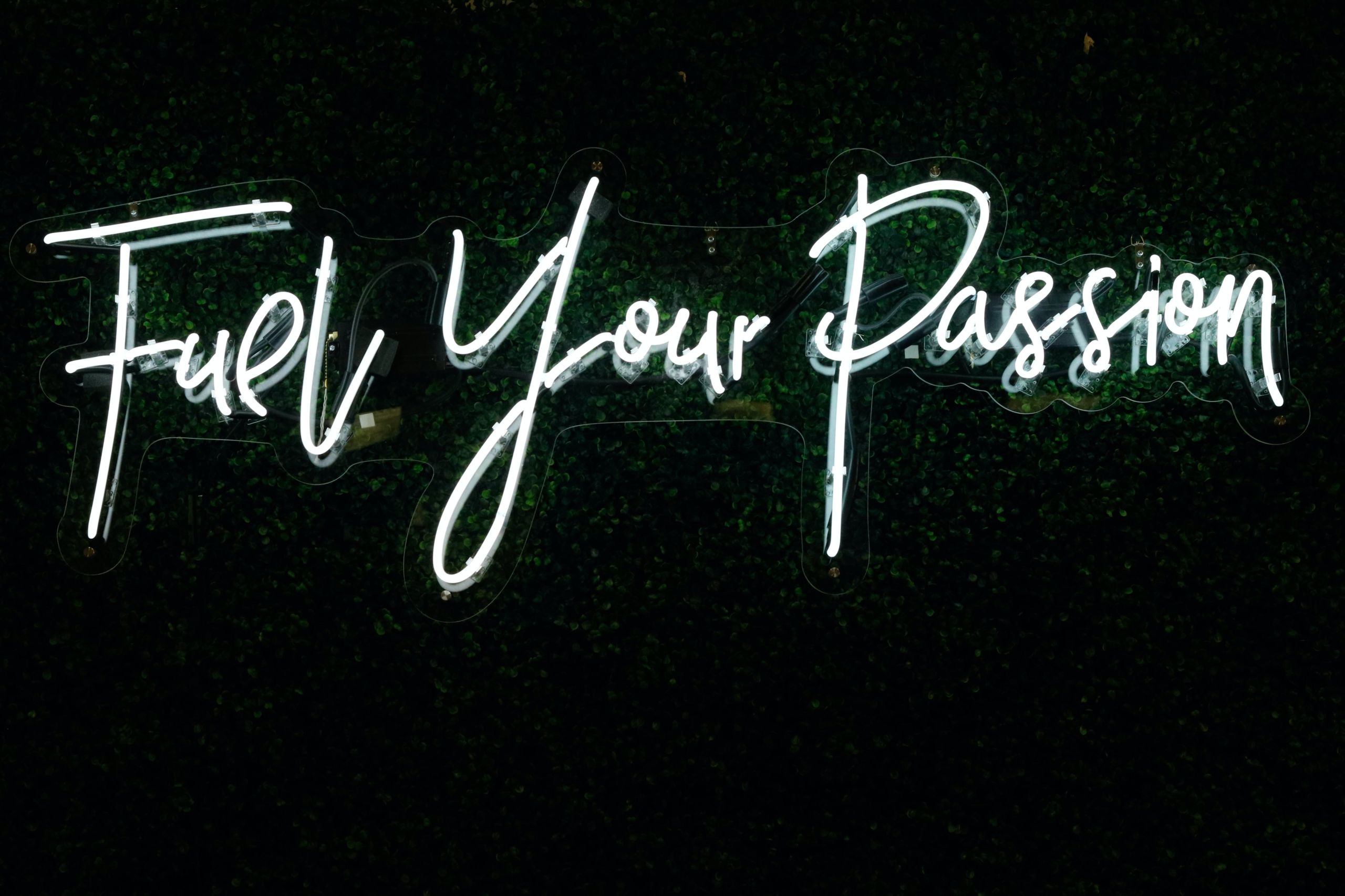 A neon sign reads "Fuel your Passion."