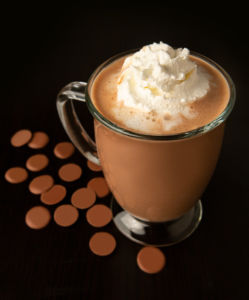 A glass mug of DeBrand Fine Chocolates hot chocolate