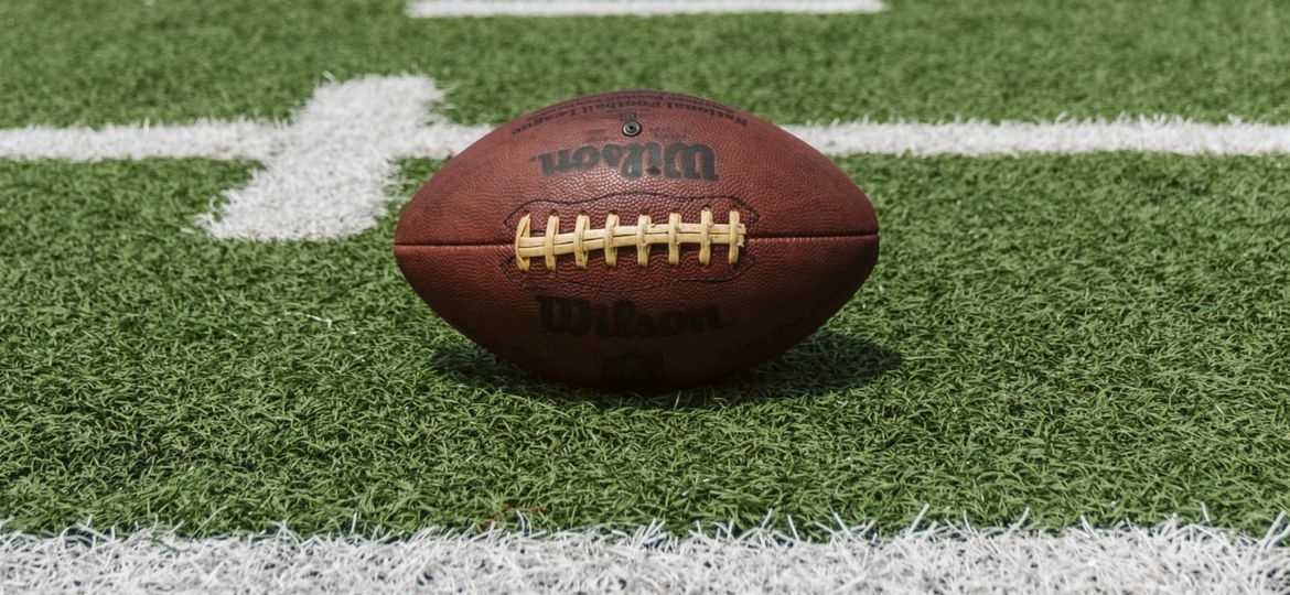 A photo of a football on a football field