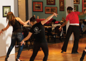 Students dancing at a Latin Expressions class