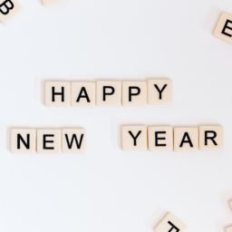 A selection of Scrabble tiles that read "Happy New Year"