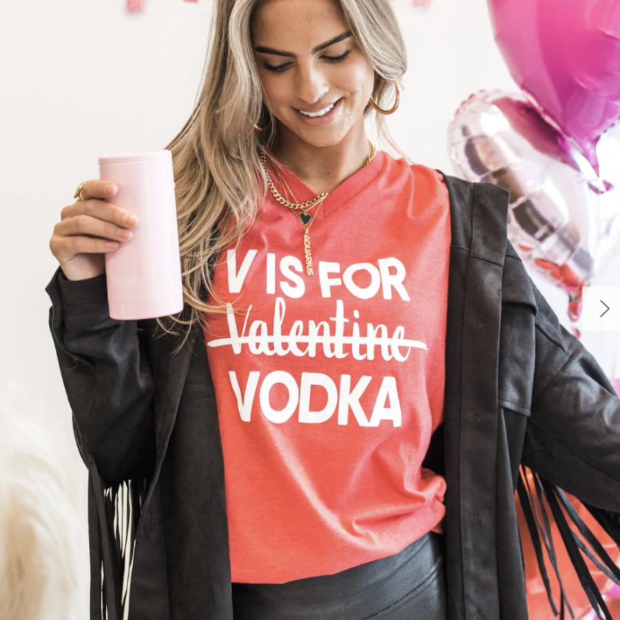 A photo of a girl in a V is for Vodka shirt