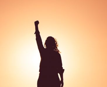 New Year Same Bitch woman with her arm in the air