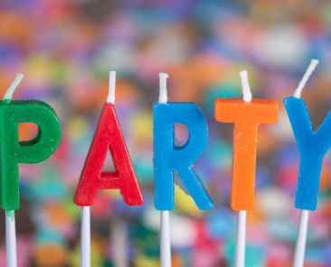 Birthday party candles spelling out the word party