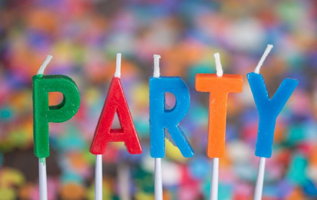 Birthday party candles spelling out the word party
