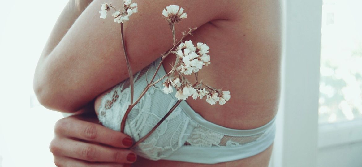 A photo of a bra fitting with flowers