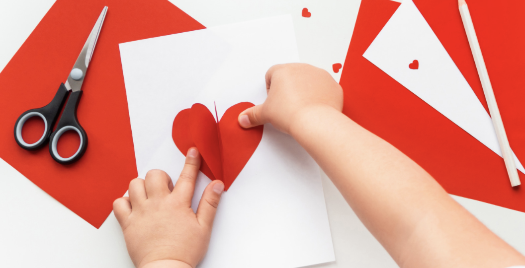 A child making a Valentine's Day card