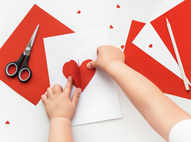 A child making a Valentine's Day card