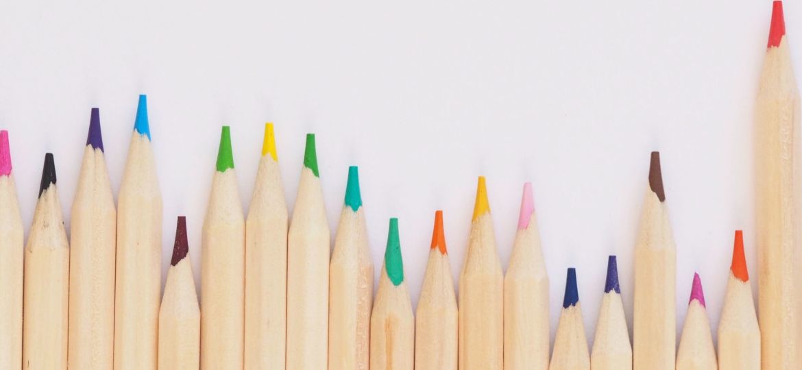 A photo of colored pencils against a white background