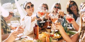 A photo of women with wine together