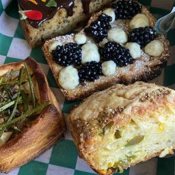 A photo of various pastries in a box