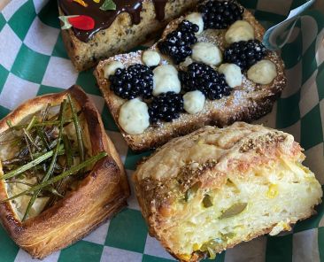 A photo of various pastries in a box