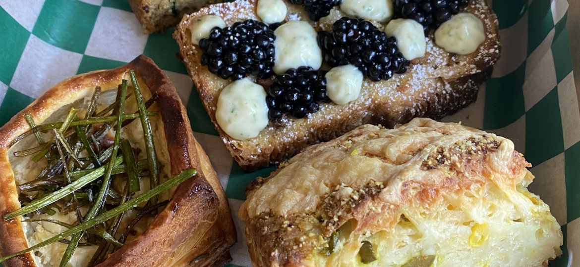 A photo of various pastries in a box