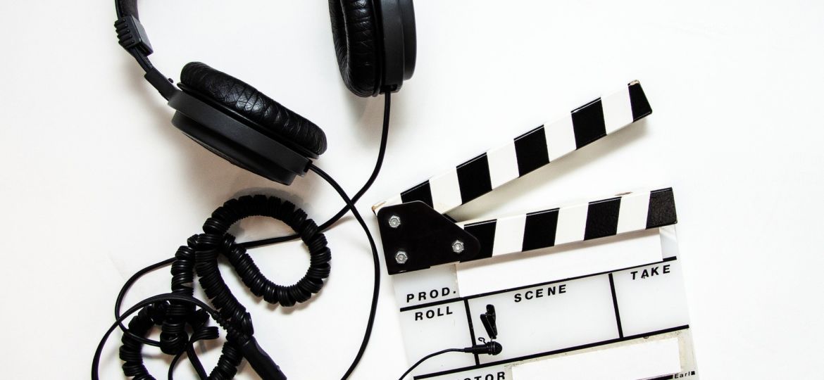 A photo of headphones and a clapboard