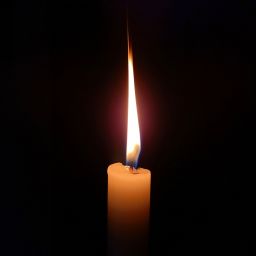 A photo of a lit candle