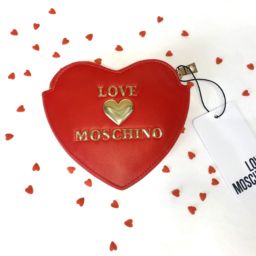 A photo of a heart-shaped Moschino coin purse