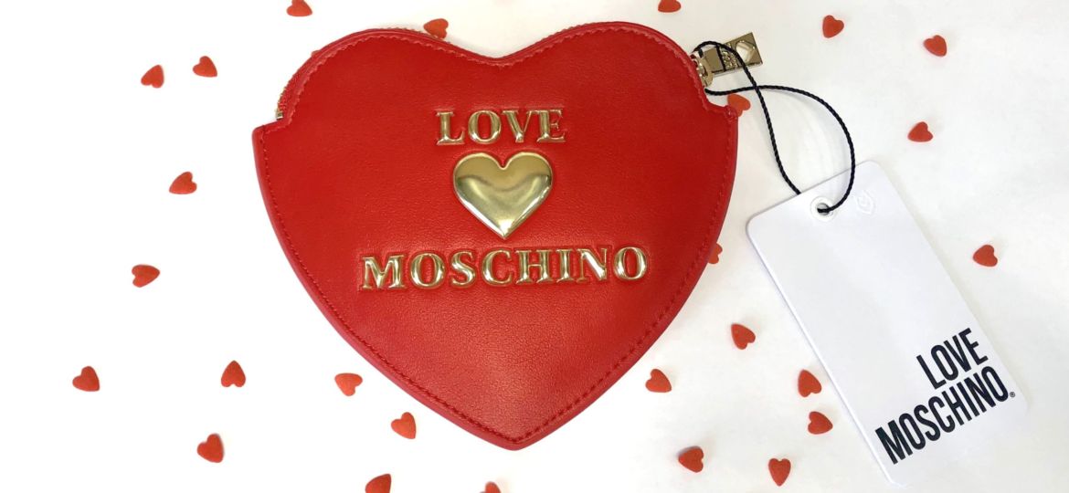 A photo of a heart-shaped Moschino coin purse