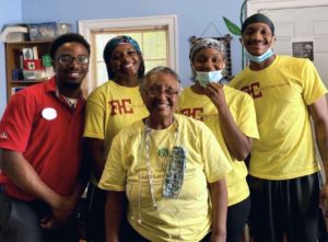 A photo of multiple people in yellow shirts