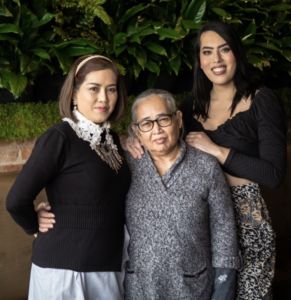 A photo of three multi-generational women who own BODHI