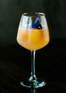 A photo of an orange cocktail