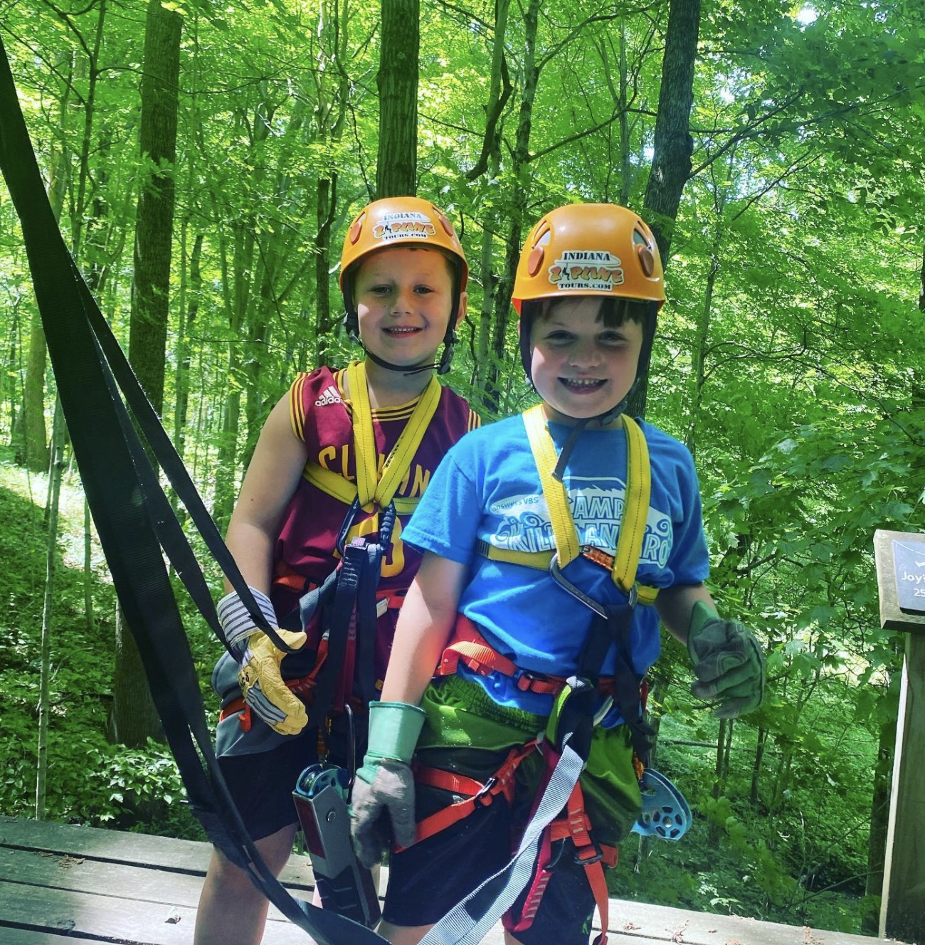 Two kids about to get active and zipline