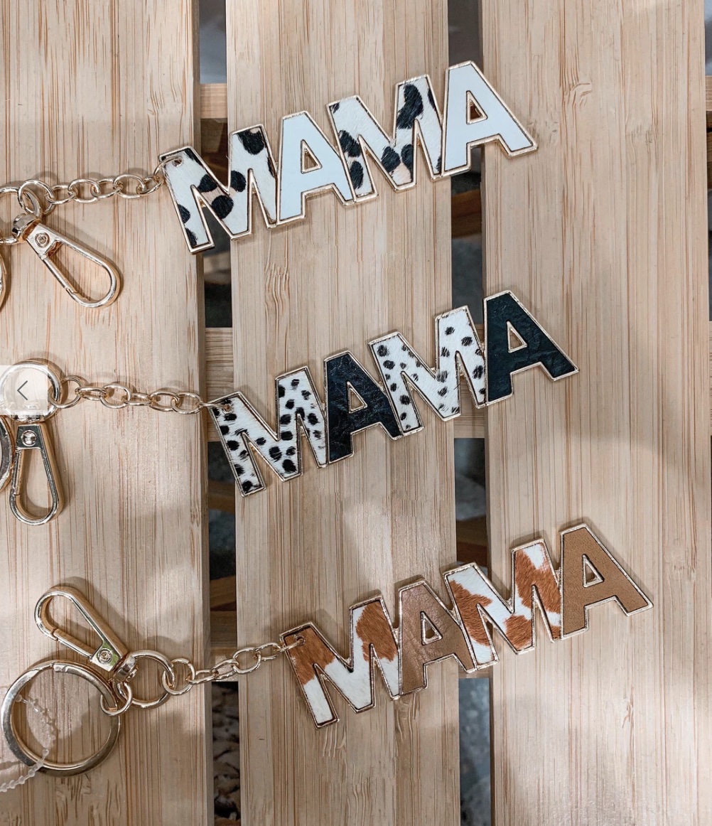 A photo of three keychains that say Mama
