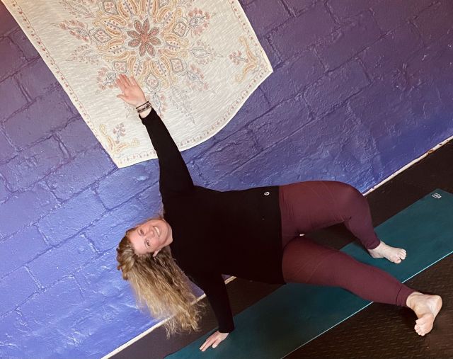 A photo of a woman doing a yoga pose
