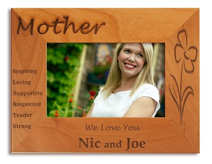 A photo of a wooden picture frame that says Mother and has a photo of a woman in it