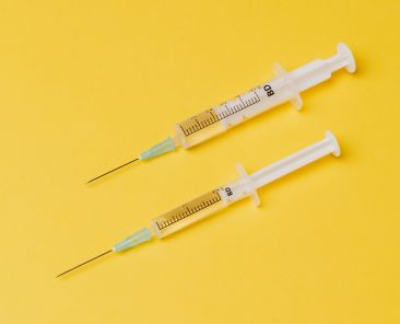 A photo of two syringes for the HPV vaccination story