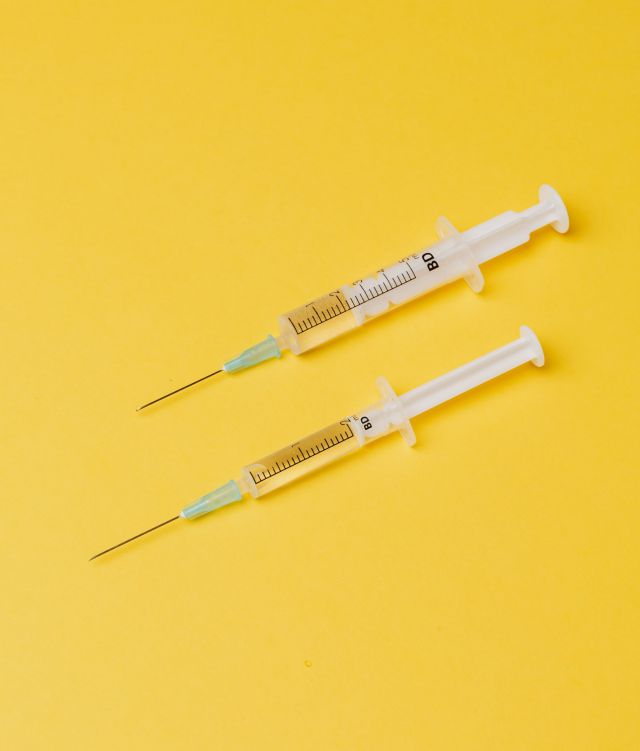 A photo of two syringes for the HPV vaccination story