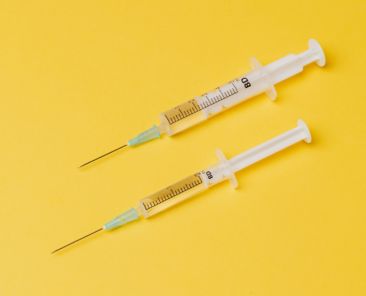 A photo of two syringes for the HPV vaccination story