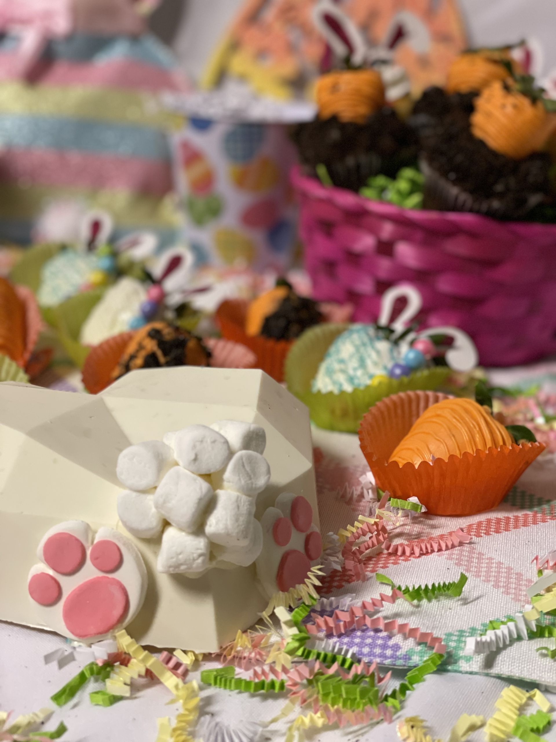 A photo of assorted Easter decorations with chocolate covered strawberries