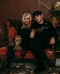 A photo of two people sitting on a couch