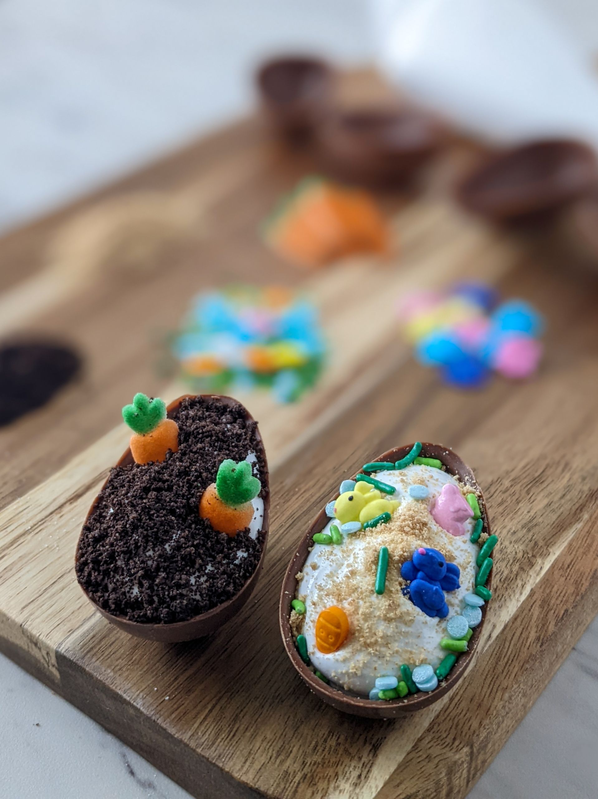 A photo of two chocolate eggs filled with cookie crumbles