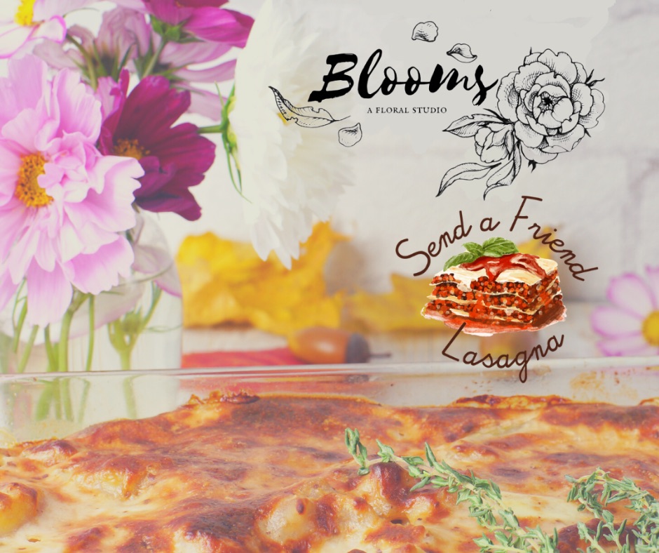A photo of a lasagna and flowers next to it