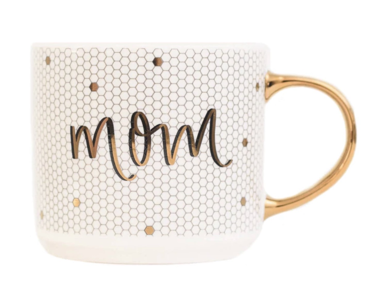 A photo of a mug that says mom and has a gold handle