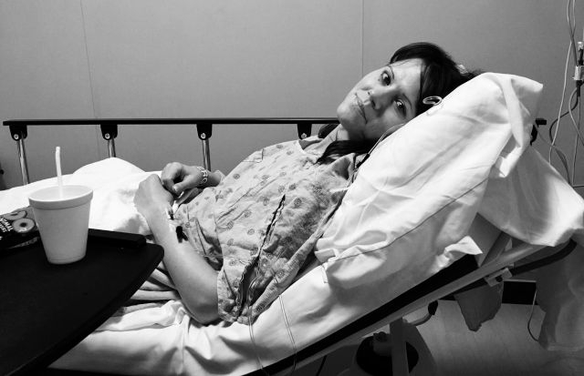 A photo of a woman in a hospital bed