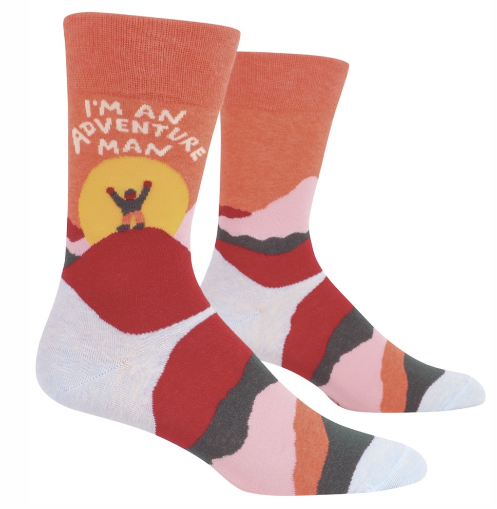 orange, red, gray, and pink socks that have a yellow sun on it with an outline of a man with his hands in the air in front of the sun