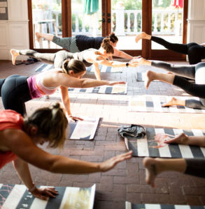 A group of women doing yoga