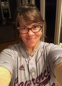 A photo of Emily Hawk in a baseball jersey