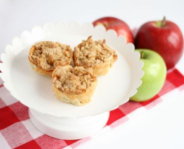 A photo of three mini apple pies
