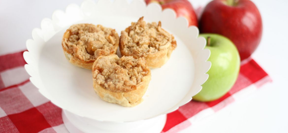 A photo of three mini apple pies